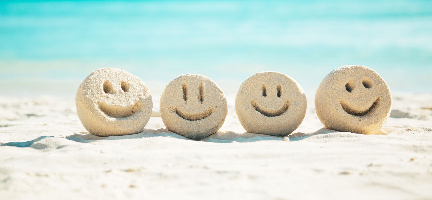 Image: Smiley faces in the sand (photo via danilovi / iStock / Getty Images Plus (danilovi / iStock / Getty Images Plus)