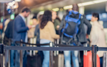 Passengers in Line at the Airport.