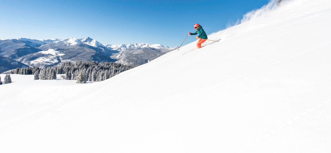 Image: Two skiers ski down a snowy hill at a Vail Resorts resort. (photo via Vail Resorts) ((photo via Vail Resorts))
