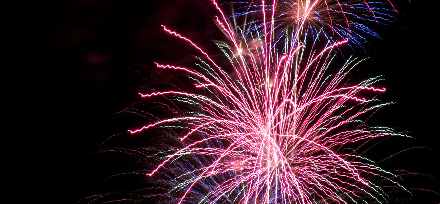 Image: PHOTO: Fireworks explode in the night sky (Photo via dr-scott / Wikimedia Commons)
