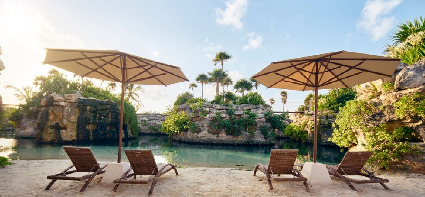 Image: Chairs by the water. (Photo Credit: Hotel Xcaret Mexico)
