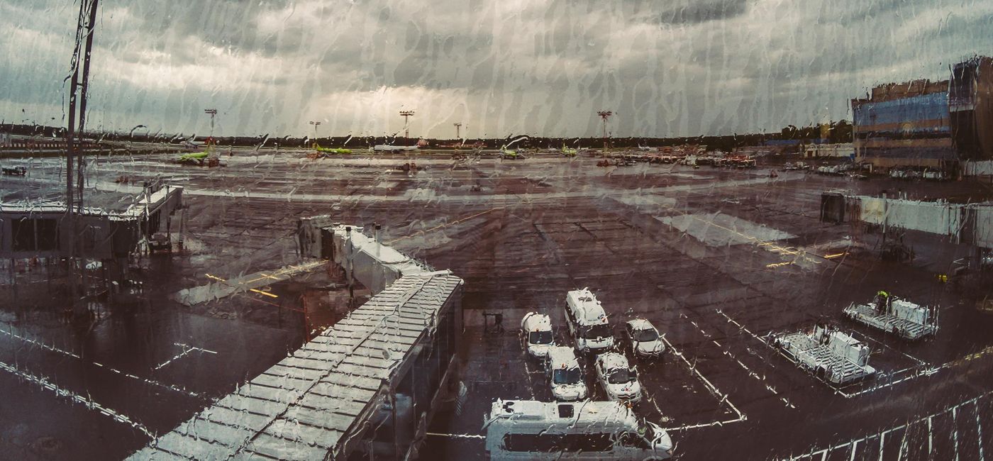 Image: Airport on a stormy day. (photo via DedMityay/iStock/Getty Images Plus)