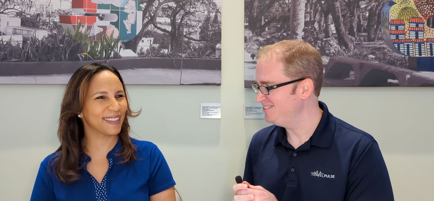 Photo: Eric Bowman interviews Jacqueline Mora, Vice Minister of Tourism Dominican Republic (Photo Credit: Eric Bowman)