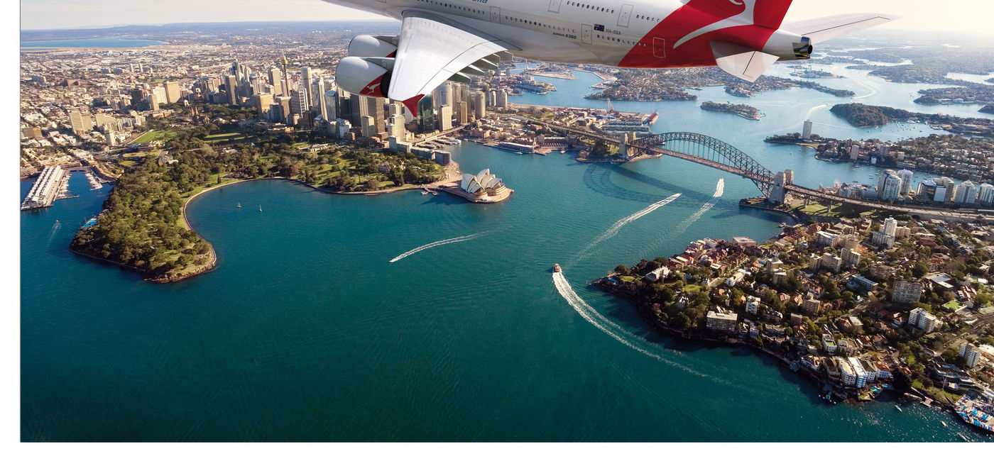 Image: PHOTO: Qantas jet over Sydney Harbor. (Photo courtesy of Qantas Airways)