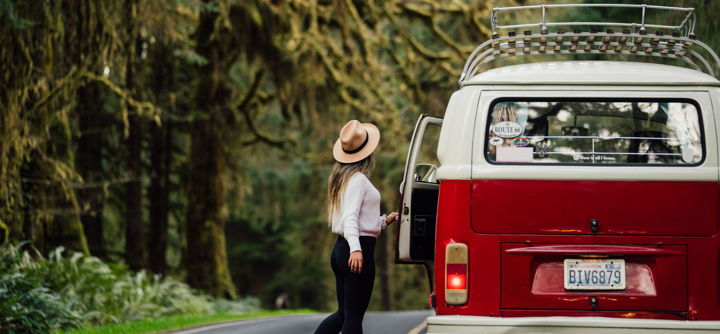 Image: A woman road tripping in her campervan. (photo courtesy of Outdoorsy.com)