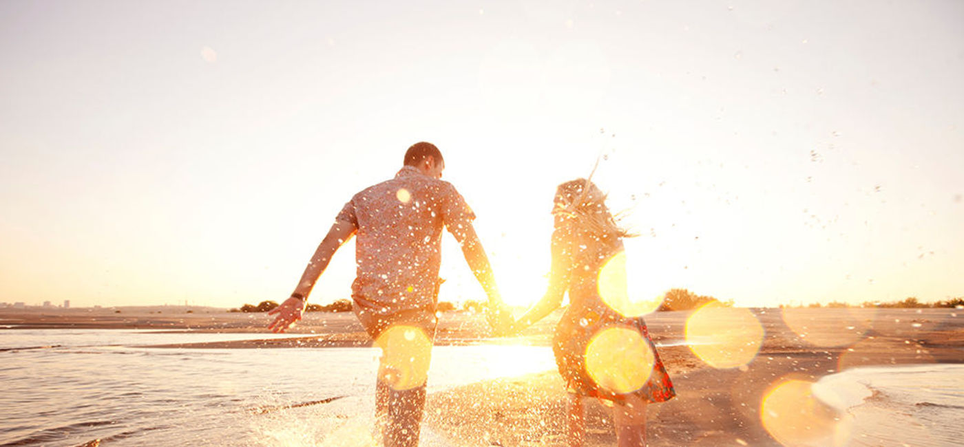 Image: PHOTO: Couple runs on a beach. (photo courtesy Thinkstock)