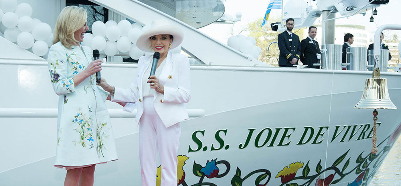 Image: PHOTO: Dame Joan Collins christens S.S. Joie de Vivre. (Photo courtesy of Steve Dunlop, Uniworld Boutique River Cruise Collection)