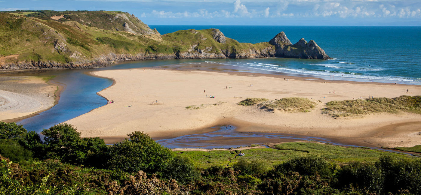 Image: Three Cliffs Bay on the Gower Peninsular, West Glamorgan, Wales, UK (TonyBaggett / iStock / Getty Images Plus)