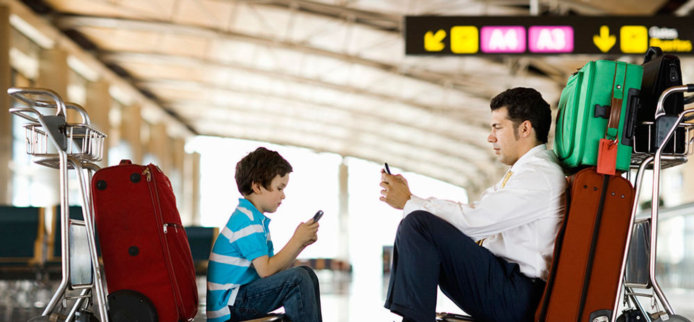 Image: PHOTO: Father and son at the airport (Photo courtesy of Thinkstock)