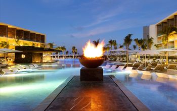 TRS Coral Hotel, swimming pool, dusk, Costa Mujeres, Mexico, Wyndham Hotels & Resorts, Palladium Hotel Group, Registry Collection Hotels 
