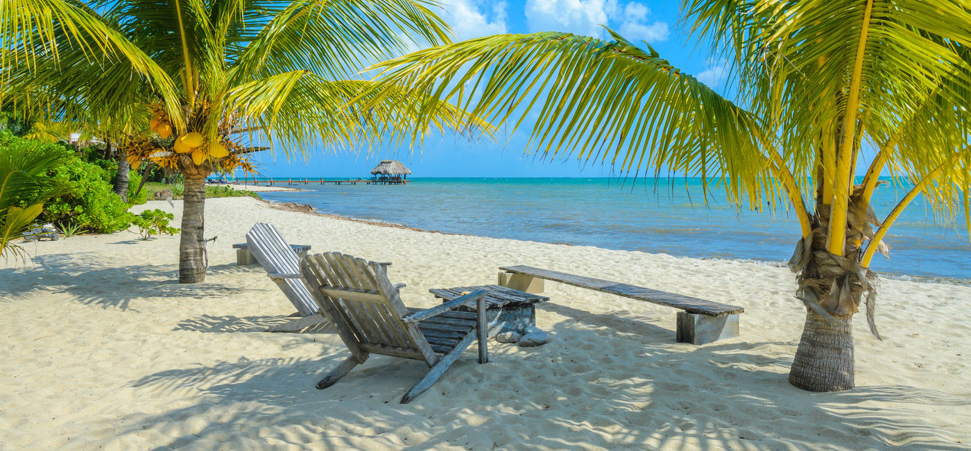 Image: A beach in Placencia, Belize. (photo via iStock / Getty Images Plus / Simon Dannhauer)