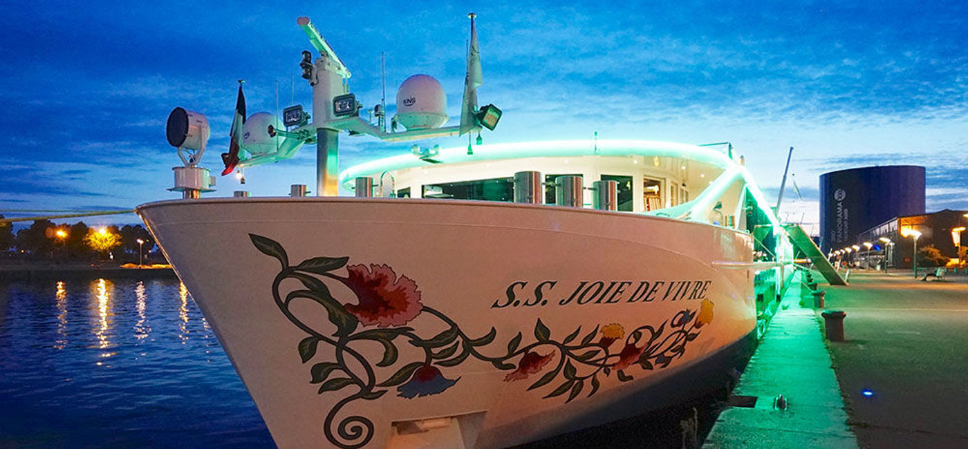 Image: PHOTO: Uniworld Boutique River Cruise Collection’s Joie de Vivre docked at night in Rouen, France. (photo by Jason Leppert)