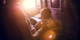 Mother with infant on airplane flight