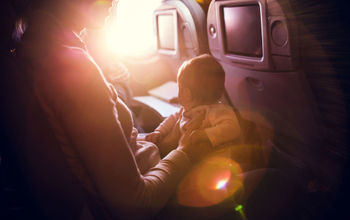Mother with infant on airplane flight