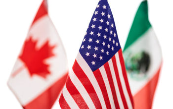 Flags of U.S., Canada and Mexico.