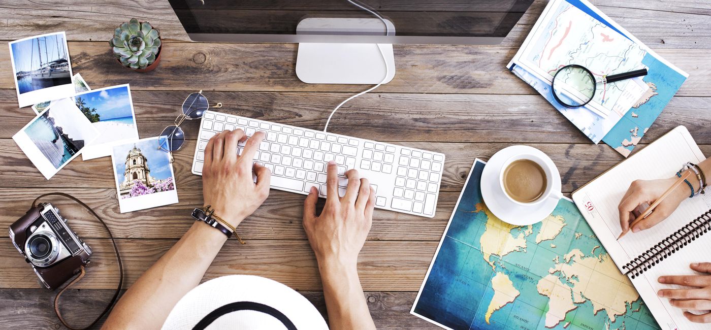 Image: Travel planning on the computer. (photo via seb_ra/iStock/Getty Images Plus)
