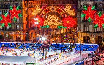 Mexico City Zocalo Christmas night celebration at ice skating rink.