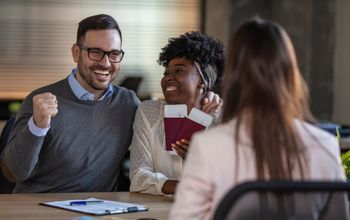 A couple booking with a travel advisor