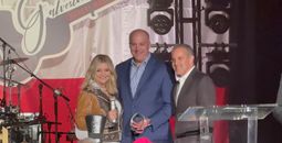 Chamber President and CEO Gina Spagnola (left) stands with Carnival Cruise Line's Chief Communications Officer Chris Chiames (middle) and 2023 Galveston Chamber Board Chair Steve Conner (right).