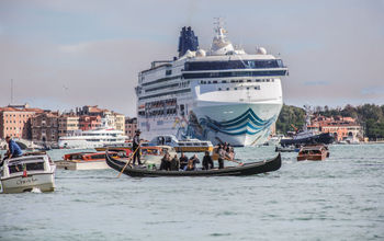 A cruise ship sailing through Venice, Italy