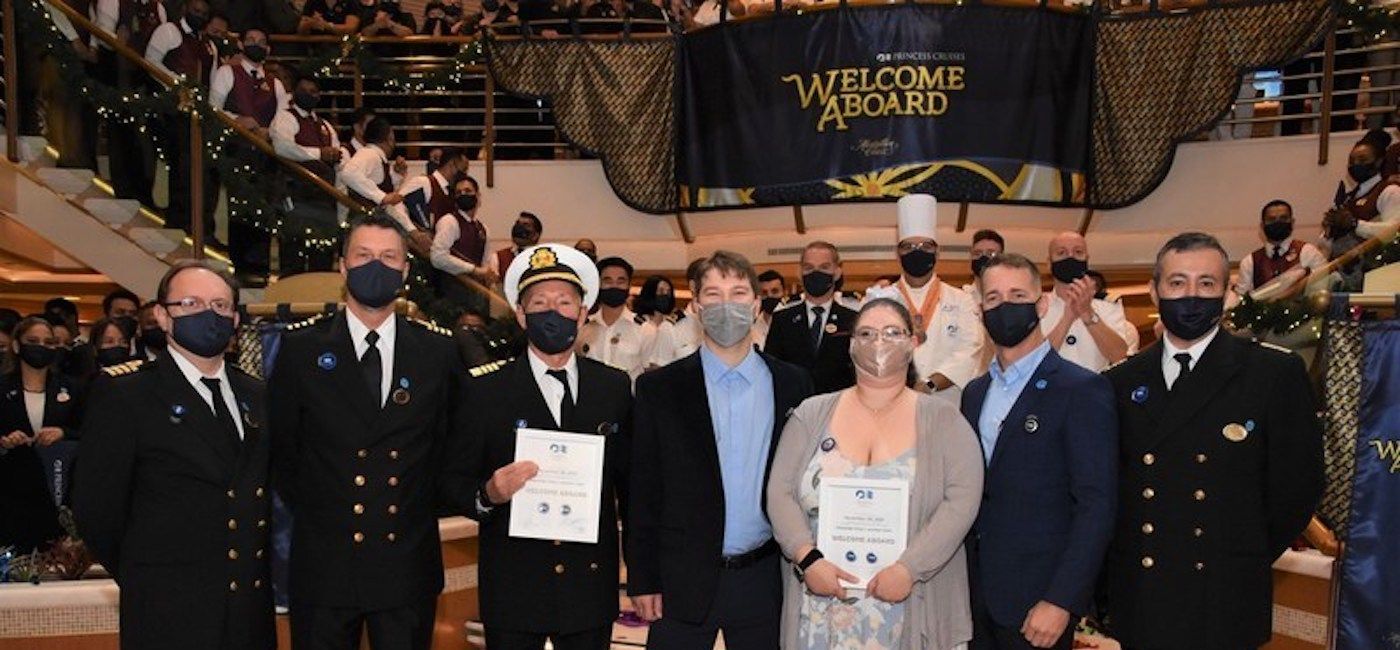 Image: Princess Cruises President John Padgett and Caribbean Princess Senior Officers welcome the ship’s first post-pandemic guests. (photo courtesy of Princess Cruises)
