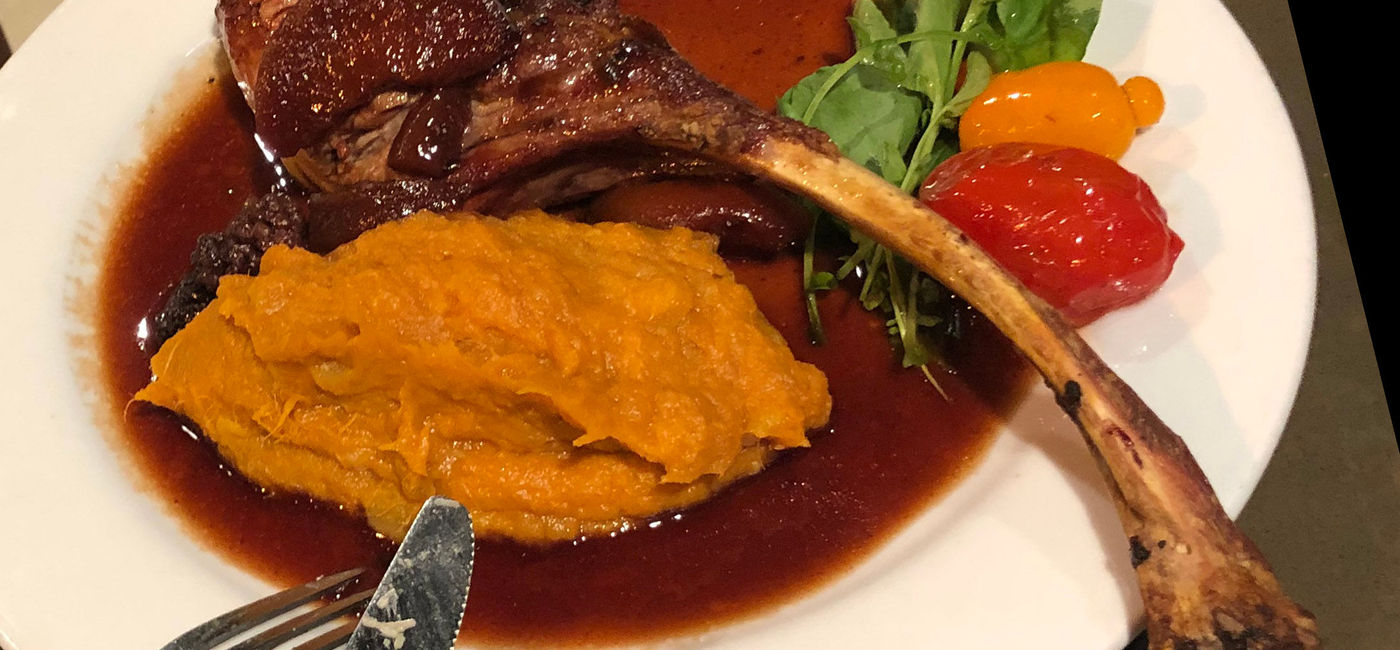 Image: The pork chop entree at Kaiser Grille Palm Springs was prepared to perfection. (photo by Paul Heney) (Photo by Paul Heney.)