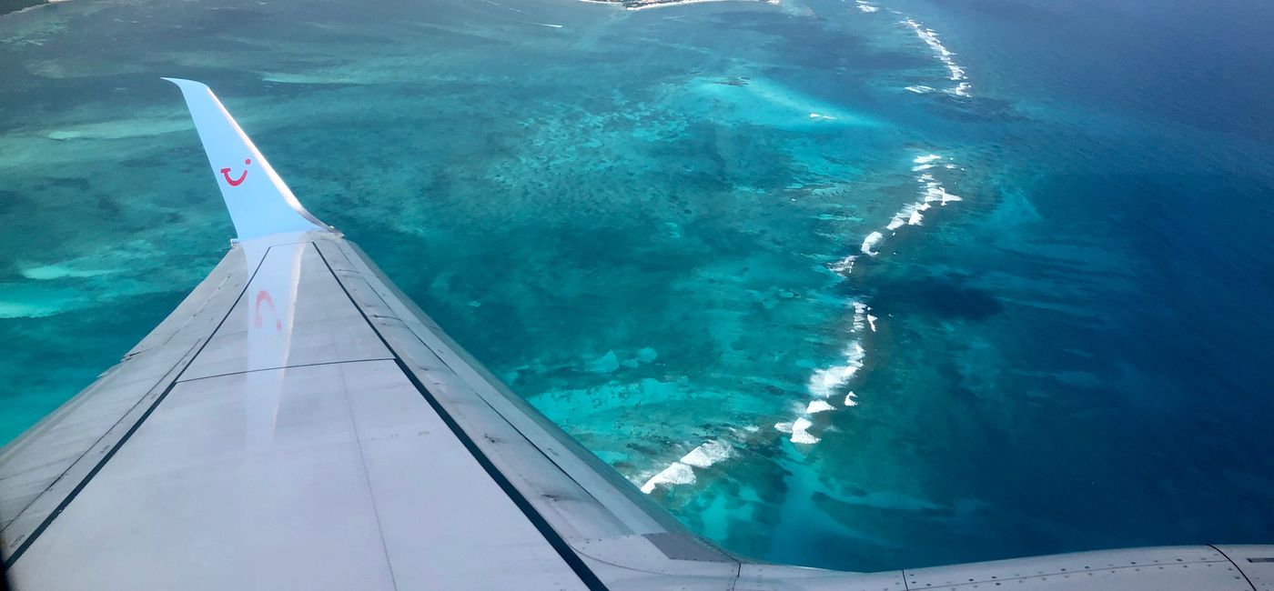 Image: A plane flying over Cancun. (photo by Codie Liermann)
