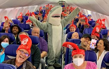 Shark Week mascot Chompie on a Southwest Flight.