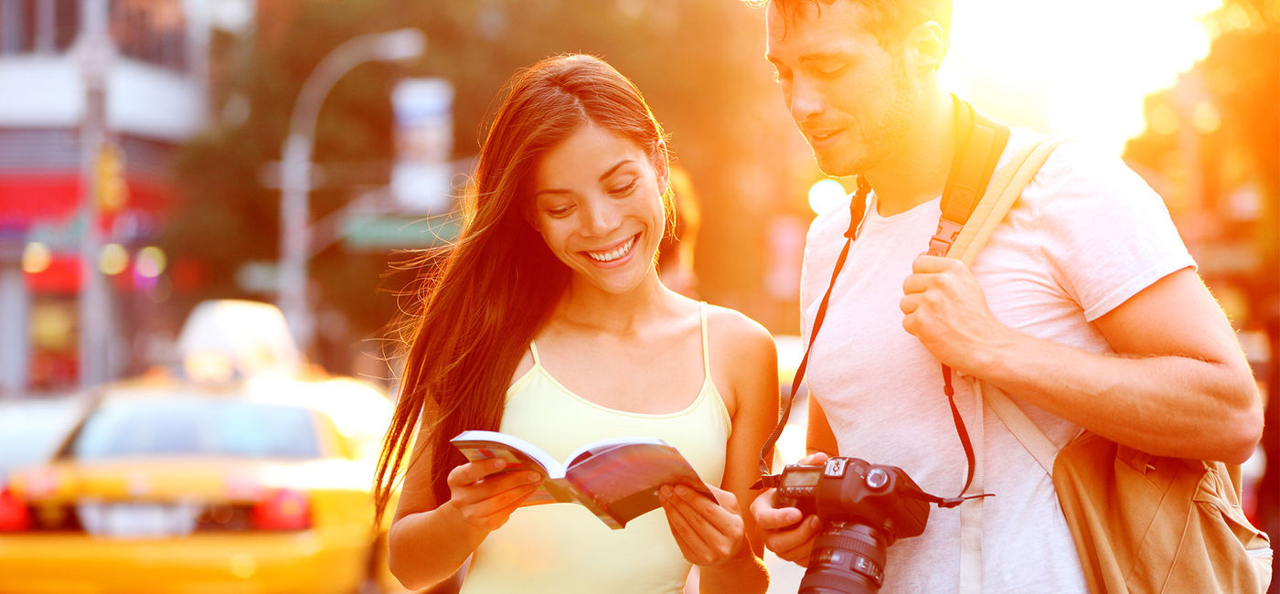 Image: Tourists in New York City. (photo courtesy Maridav/iStock/Getty Images Plus)