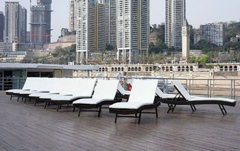 river ship deck passing a city