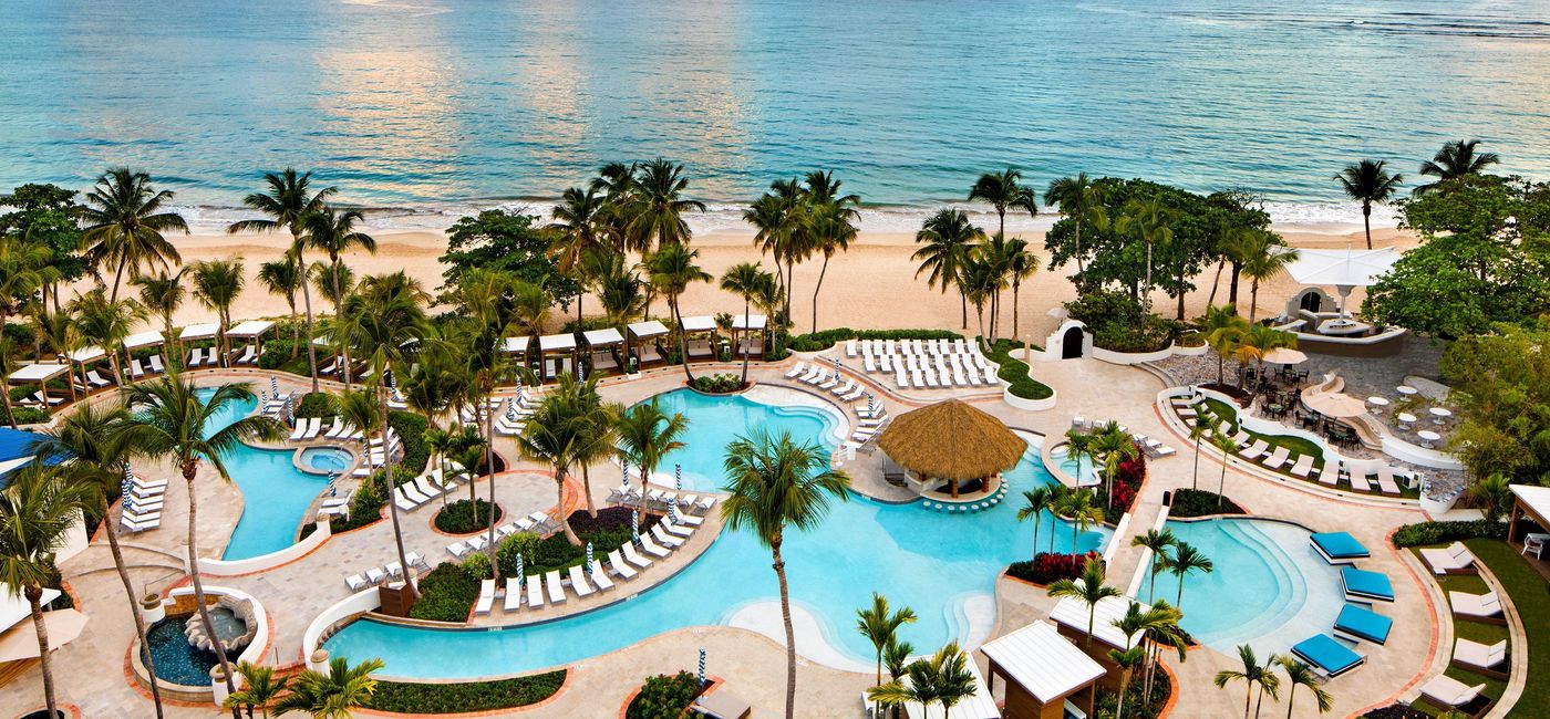 Image: PHOTO: The pools and beach area at El San Juan Hotel. (photo via El San Juan Hotel)