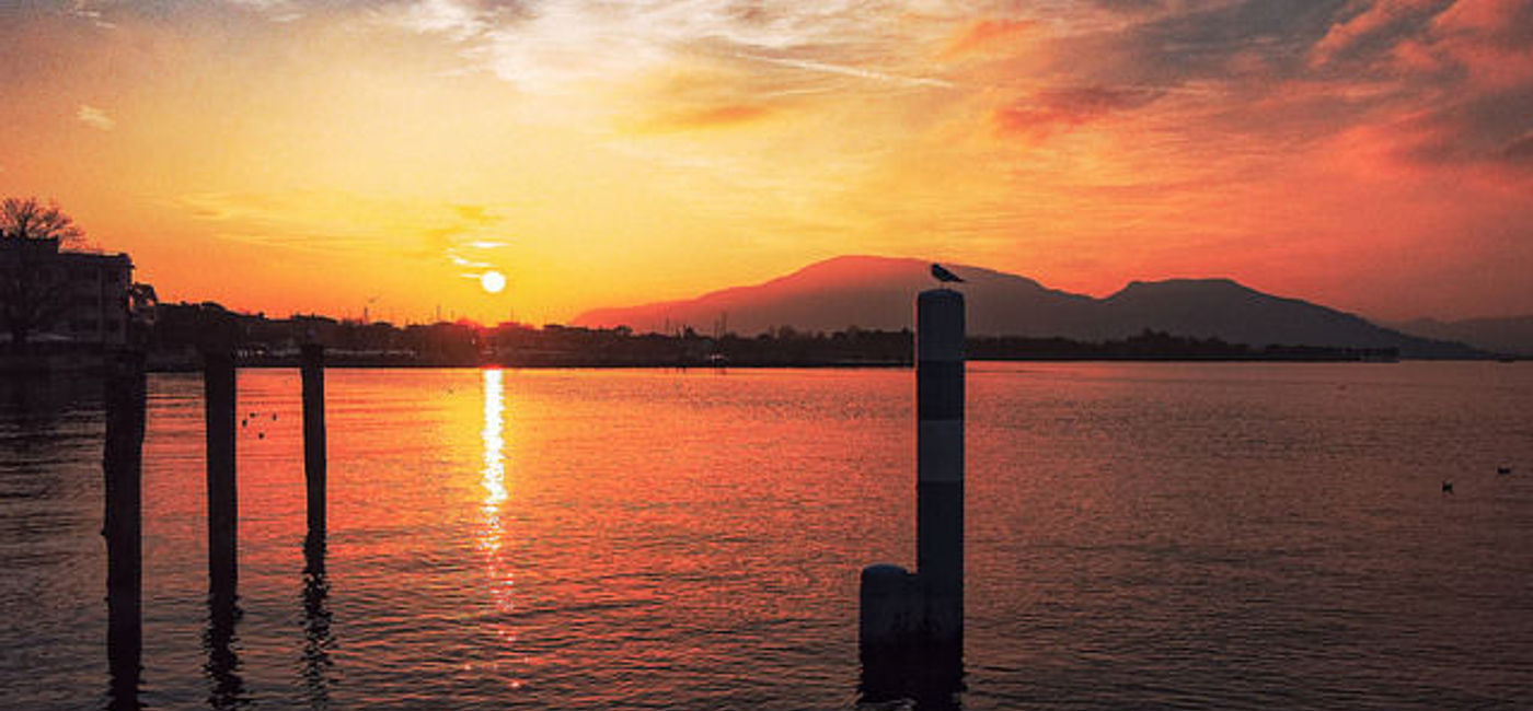 Image: PHOTO: Sunset at Lake Iseo, Italy. (photo via Flickr/Davide Zampatti)