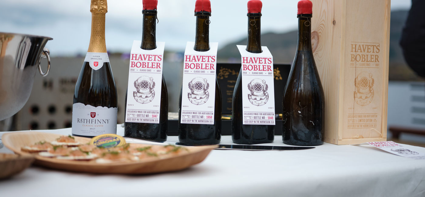 Image: Bottles from the initial batch of submerged sparkling wine (Photo Credit: Kristian Dale/Hurtigruten)