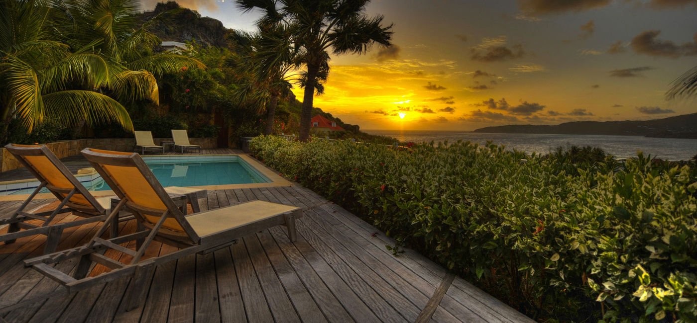 Image: Romantic sunset in St Barts. (clinedsgn/iStock/Getty Images Plus)