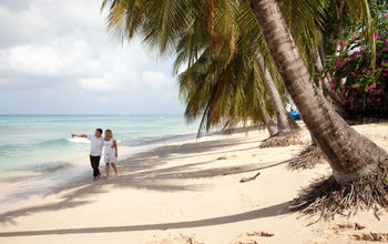 Couple walking on the beach in Barbados