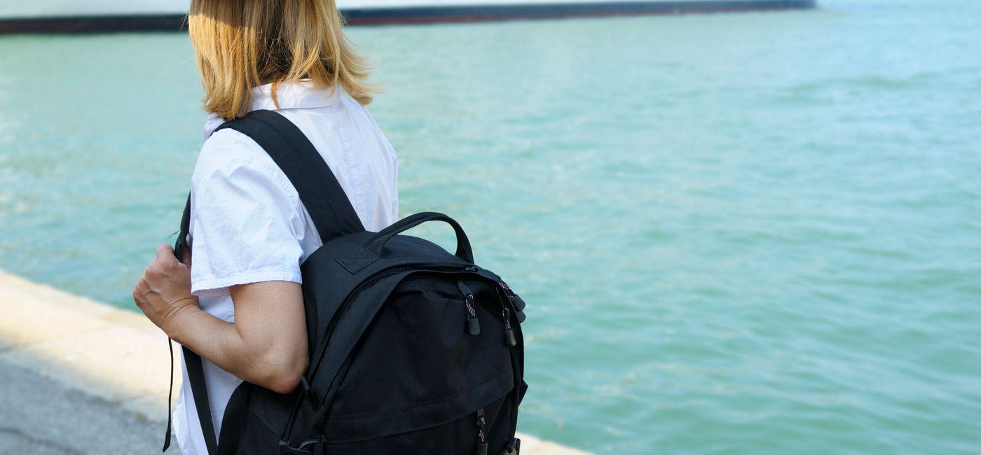 Image: Woman Waiting for Cruise Ship. (photo via Lisa-Blue / E+)
