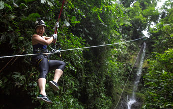 Woman canyoneering in La Fortuna, Costa Rica