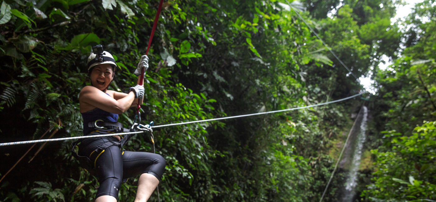 Image: Woman canyoneering in La Fortuna, Costa Rica. (photo courtesy of G Adventures)