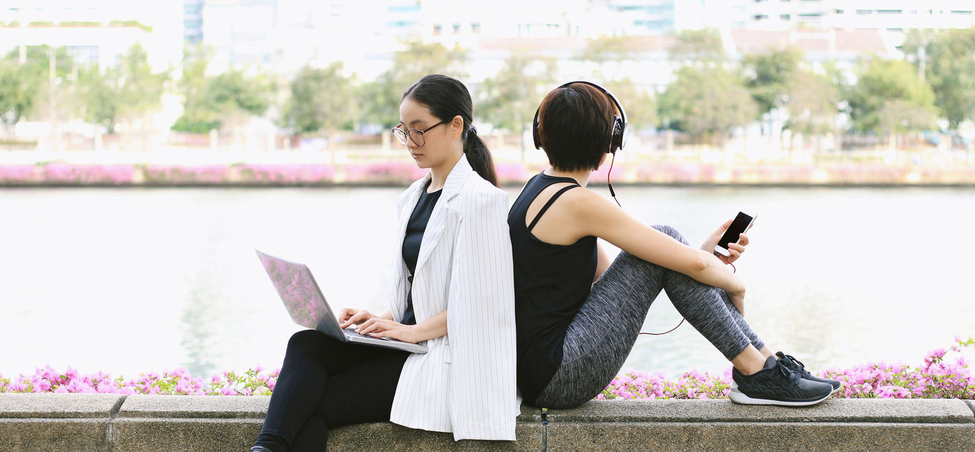 Image: PHOTO: Businesswoman working on her laptop in the park. (Photo via iStock/Getty Images Plus/Artfully79)