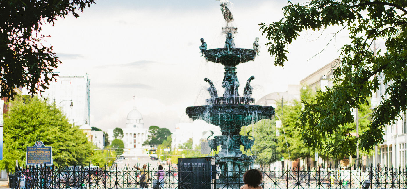 Image: A woman and her daughter stand in front of the fountain in Montgomery, Alabama. (photo via Experience Montgomery) ((photo via Experience Montgomery))