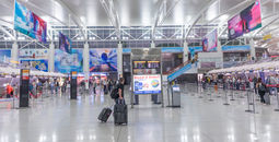 Travelers checking in at New York's John F Kennedy International Airport