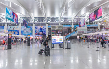 Travelers checking in at New York's John F Kennedy International Airport