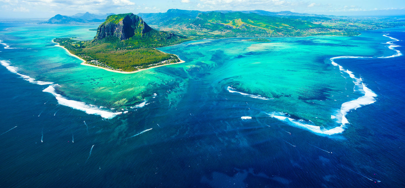 Photo: Aerial view of Mauritius and the underwater waterfall. (photo via Myroslava/iStock/Getty Images Plus)