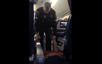 Woman dragged off Delta flight in Detroit