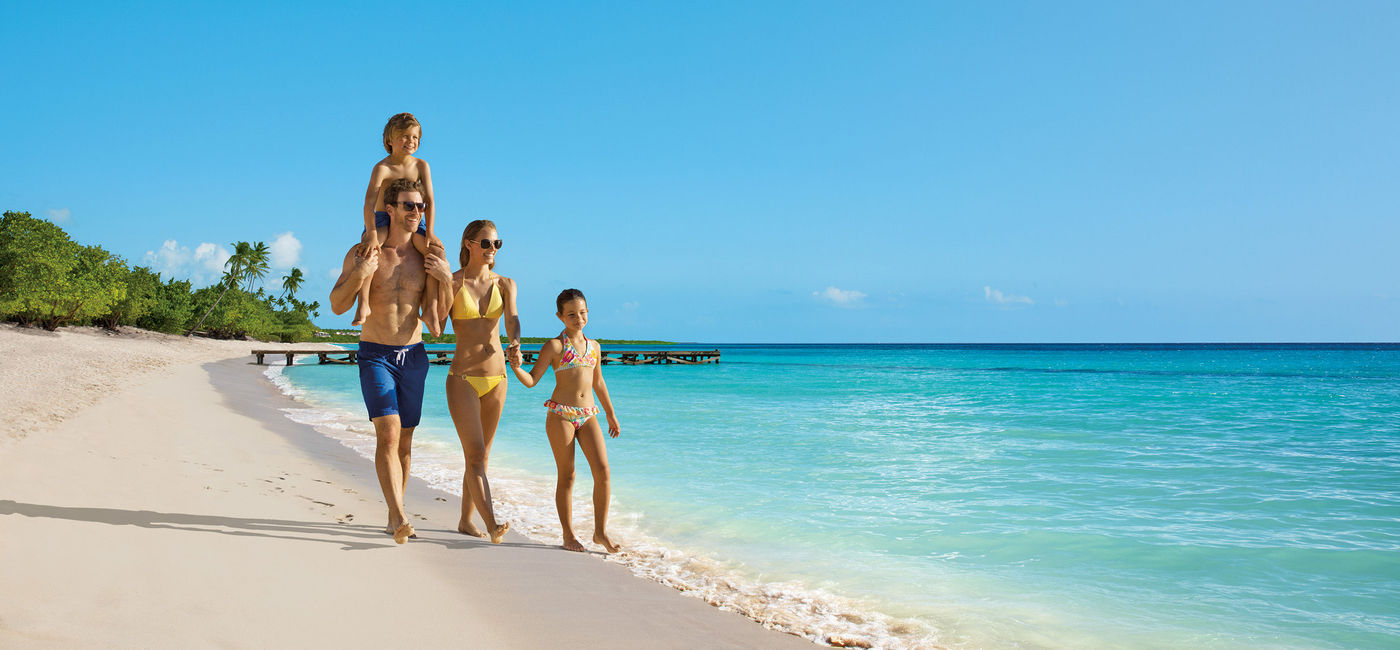 Image: Family walks on the beach. (photo via Apple Leisure Group)