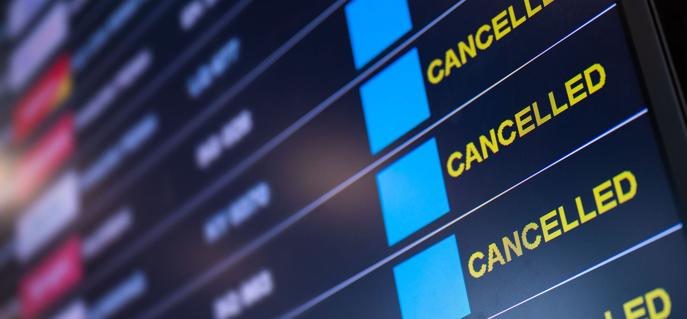 Image: Flight cancellations at airport. (photo via structuresxx / iStock / Getty Images Plus)