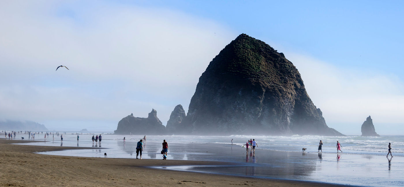 Image: Cannon Beach, Oregon with Haystack Rock in the background. (Photo via OGphoto/iStock/Getty Images Plus)