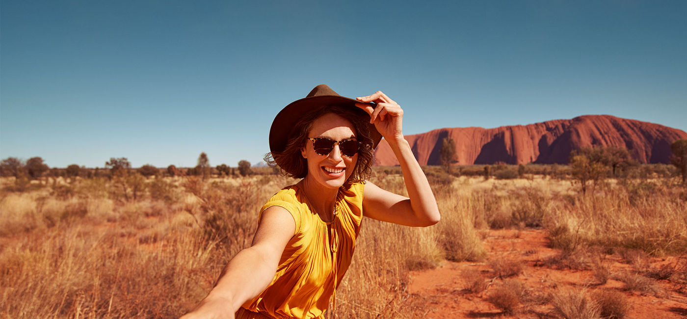 Image: Traveler at Uluru, Australia. (photo courtesy Tourism Australia)
