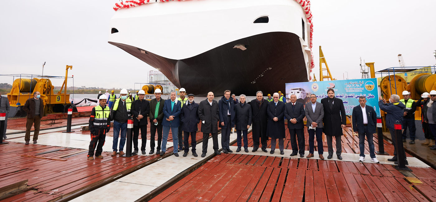 Image: The Viking Osiris and its construction team and other Viking officials pose together during the floating out ceremony. (photo via Viking) ((photo via Viking))