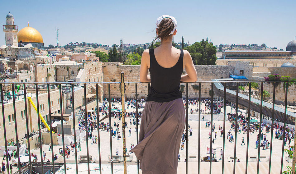 Women looks on at Jerusalem old city, Israel